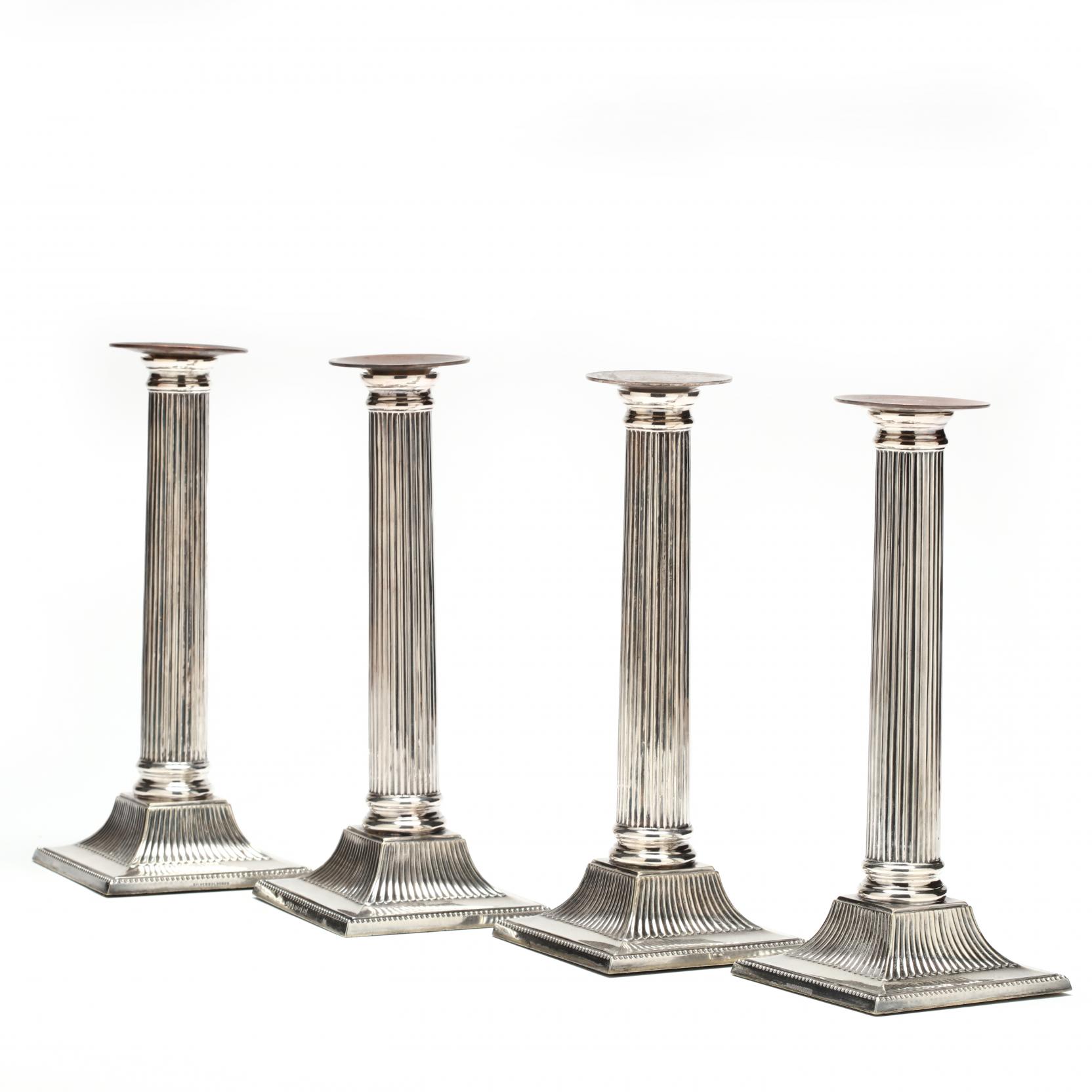 set-of-four-neoclassical-style-silverplate-candlesticks