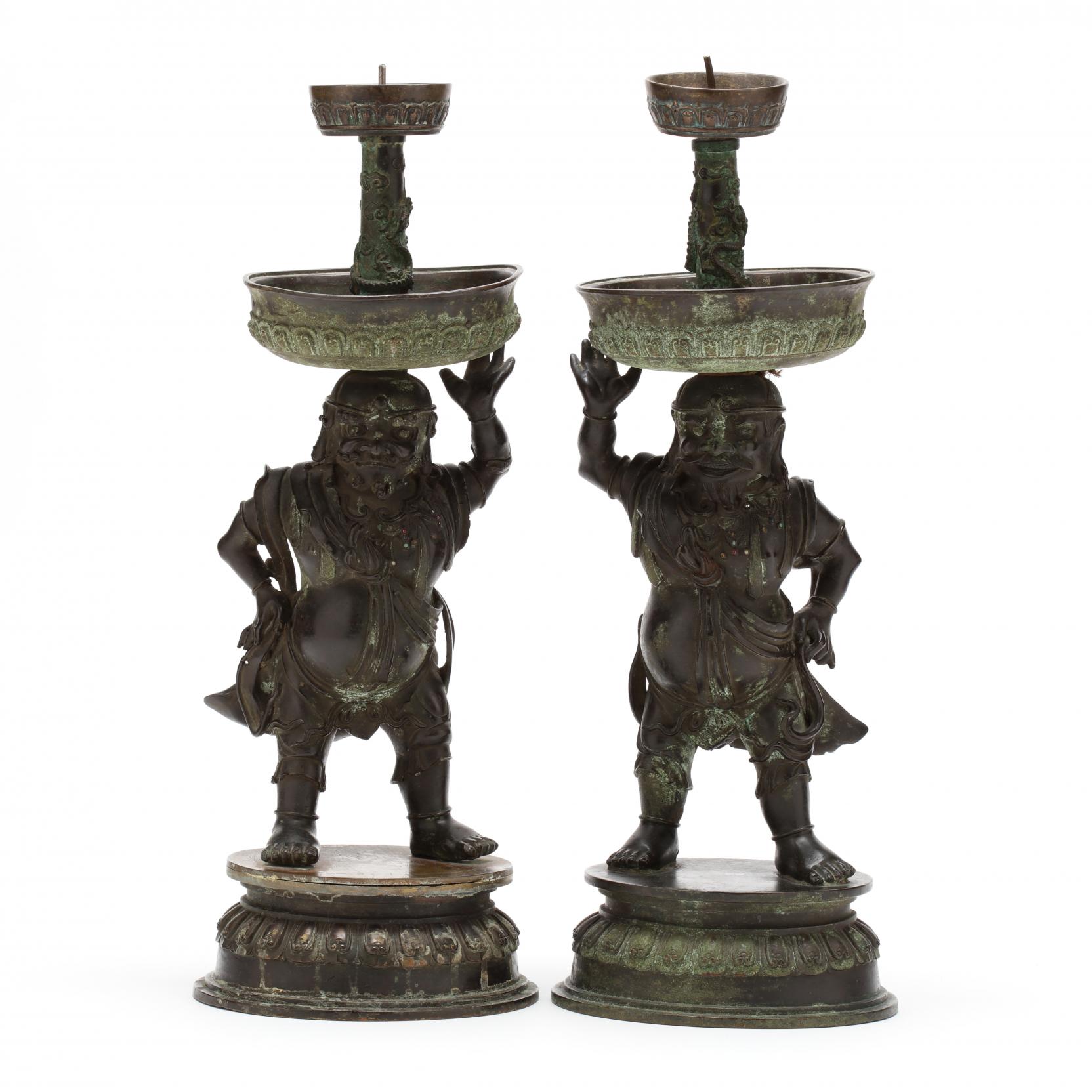 a-rare-pair-of-chinese-bronze-foreigner-pricket-candlesticks