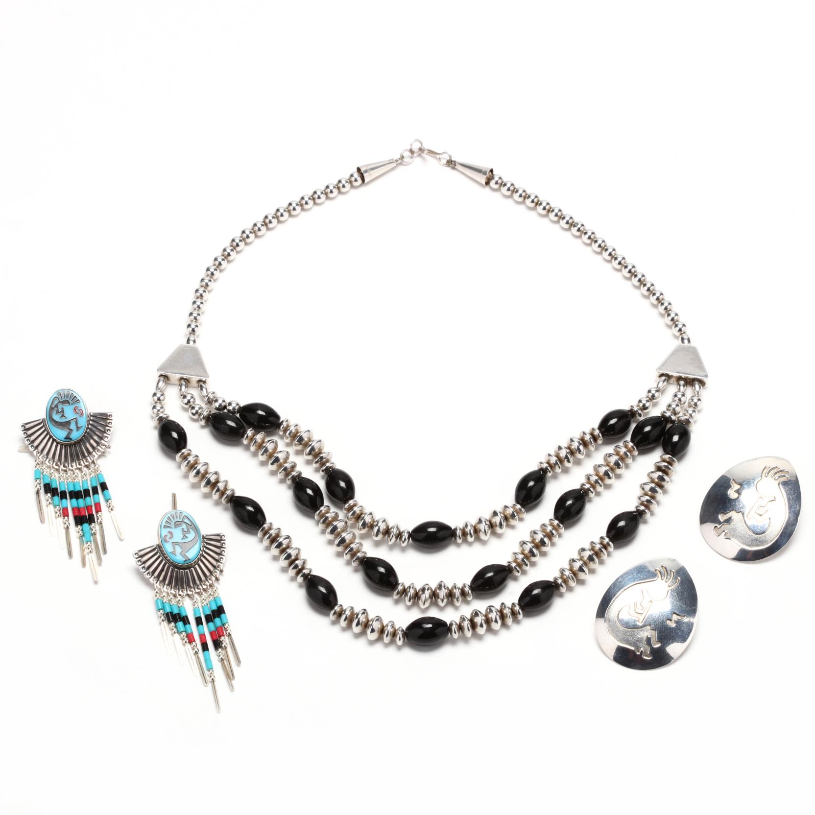 three-silver-jewelry-items