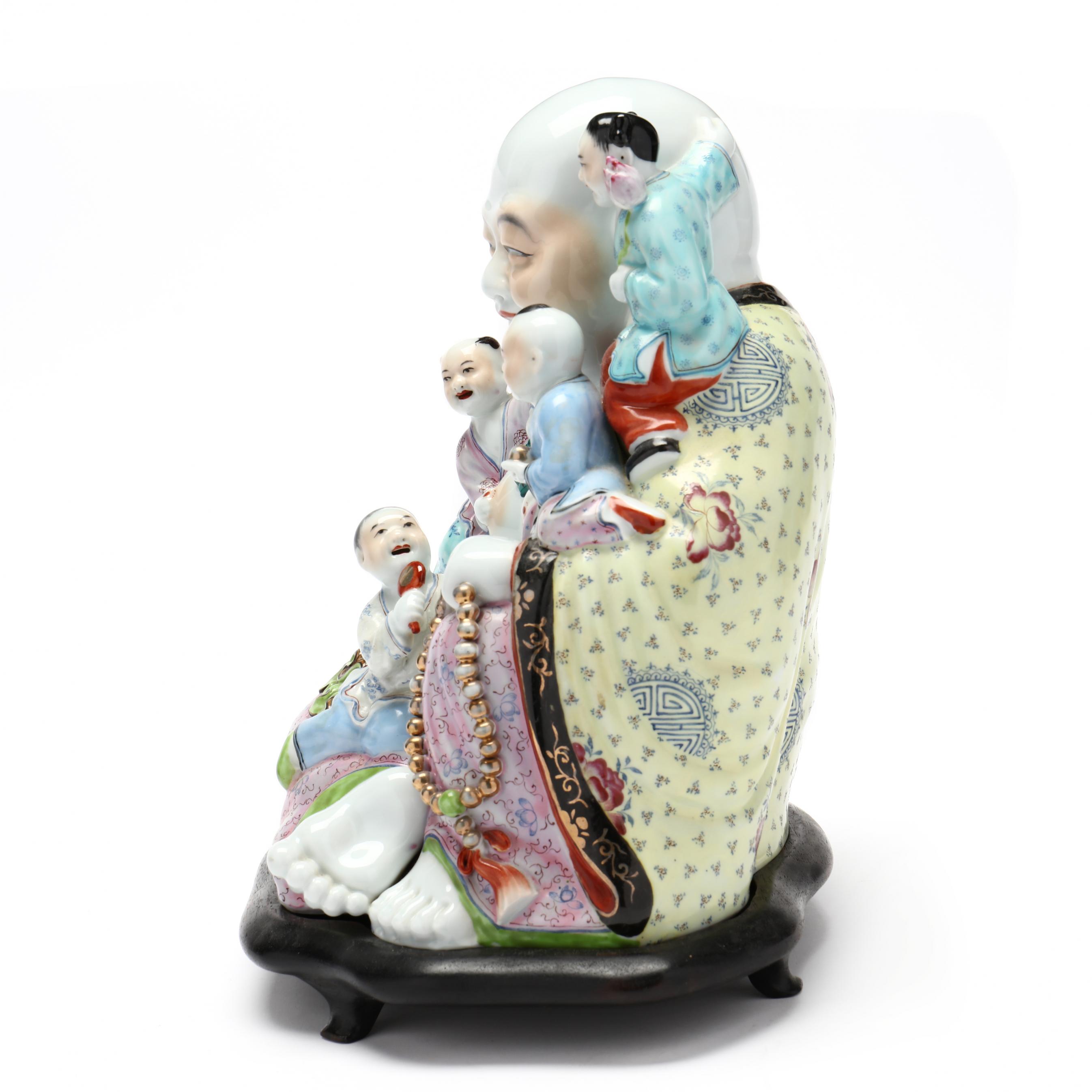 A Chinese Famille Rose Porcelain Laughing Buddha Sculpture (Lot 10