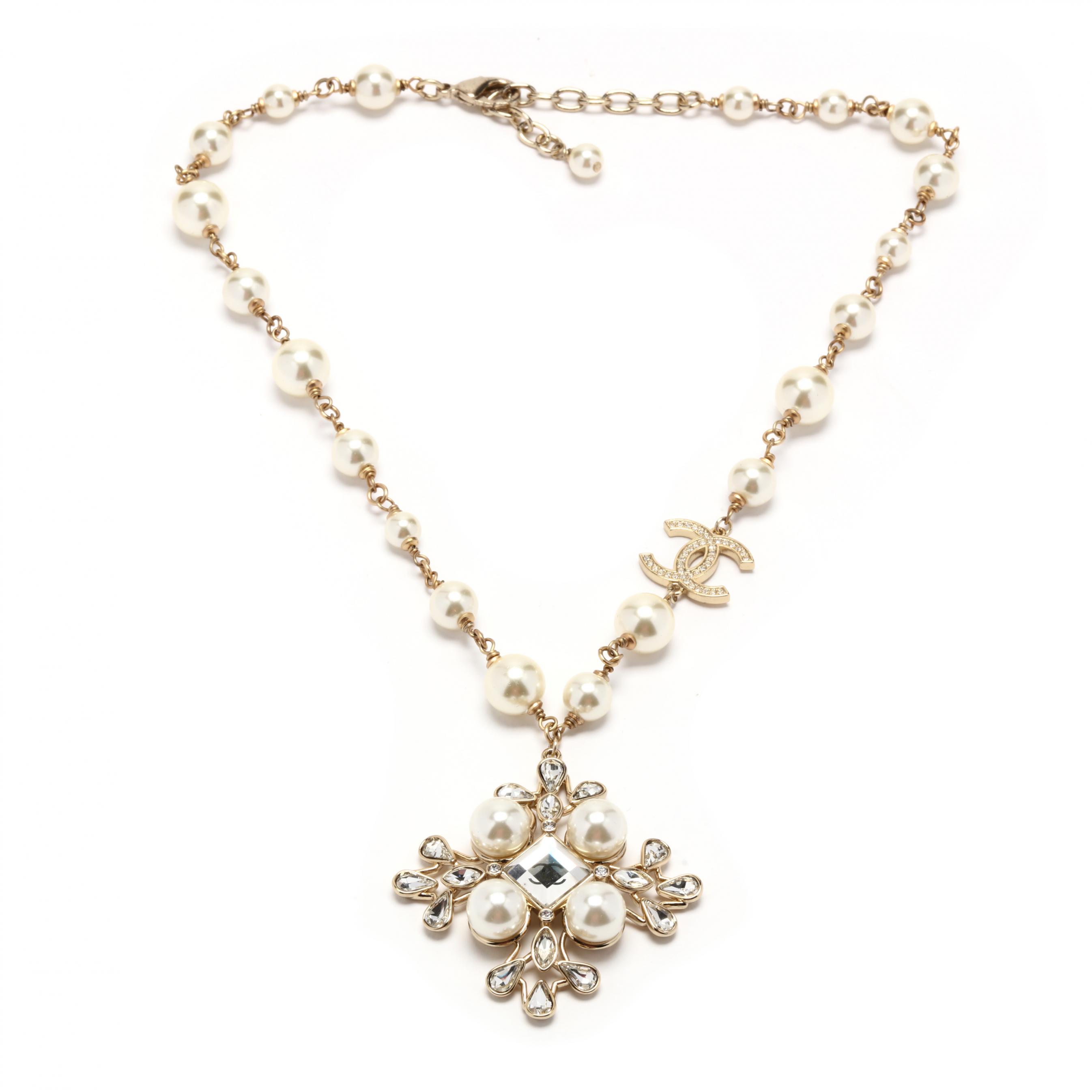 Sold at Auction: A Chanel CC Crystal Faux Pearl Pendant Necklace
