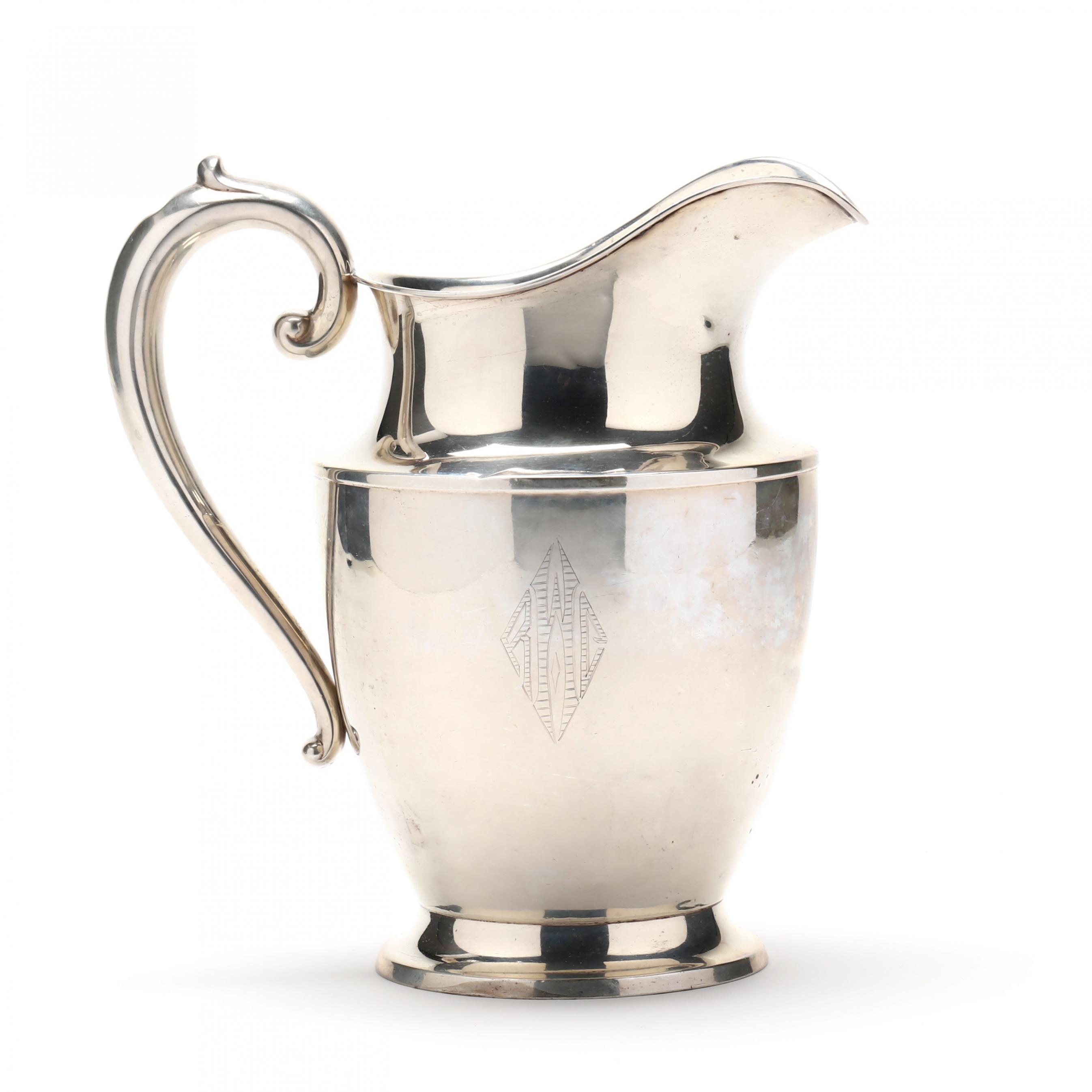 A Sterling Silver Water Pitcher by Wallace (Lot 1363 - Holiday