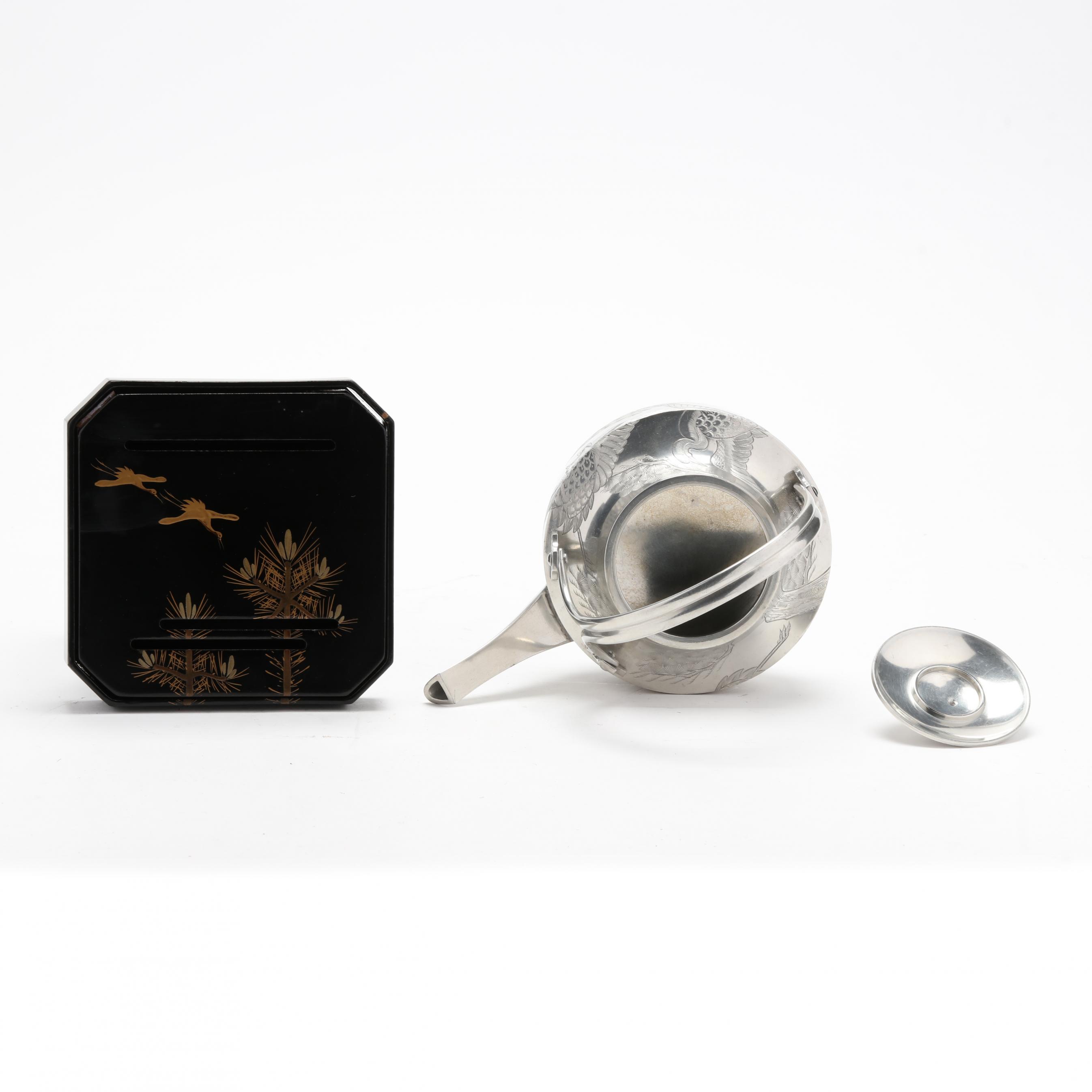 A Japanese Pewter Sake Pot with Lacquer and Gilt Stand (Lot 1132