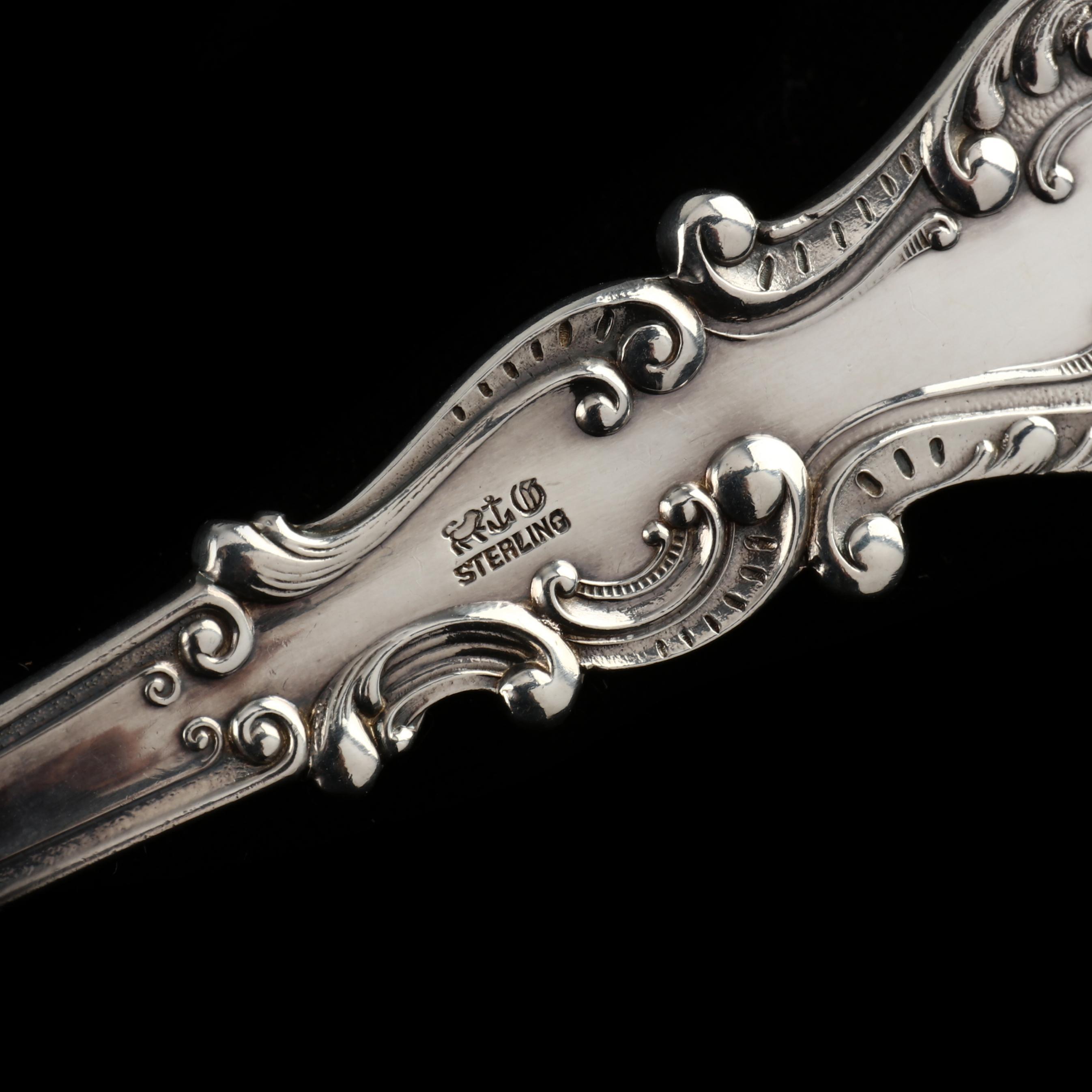A Gorham Sterling Silver Serving Spoon and an .800 Silver Folding