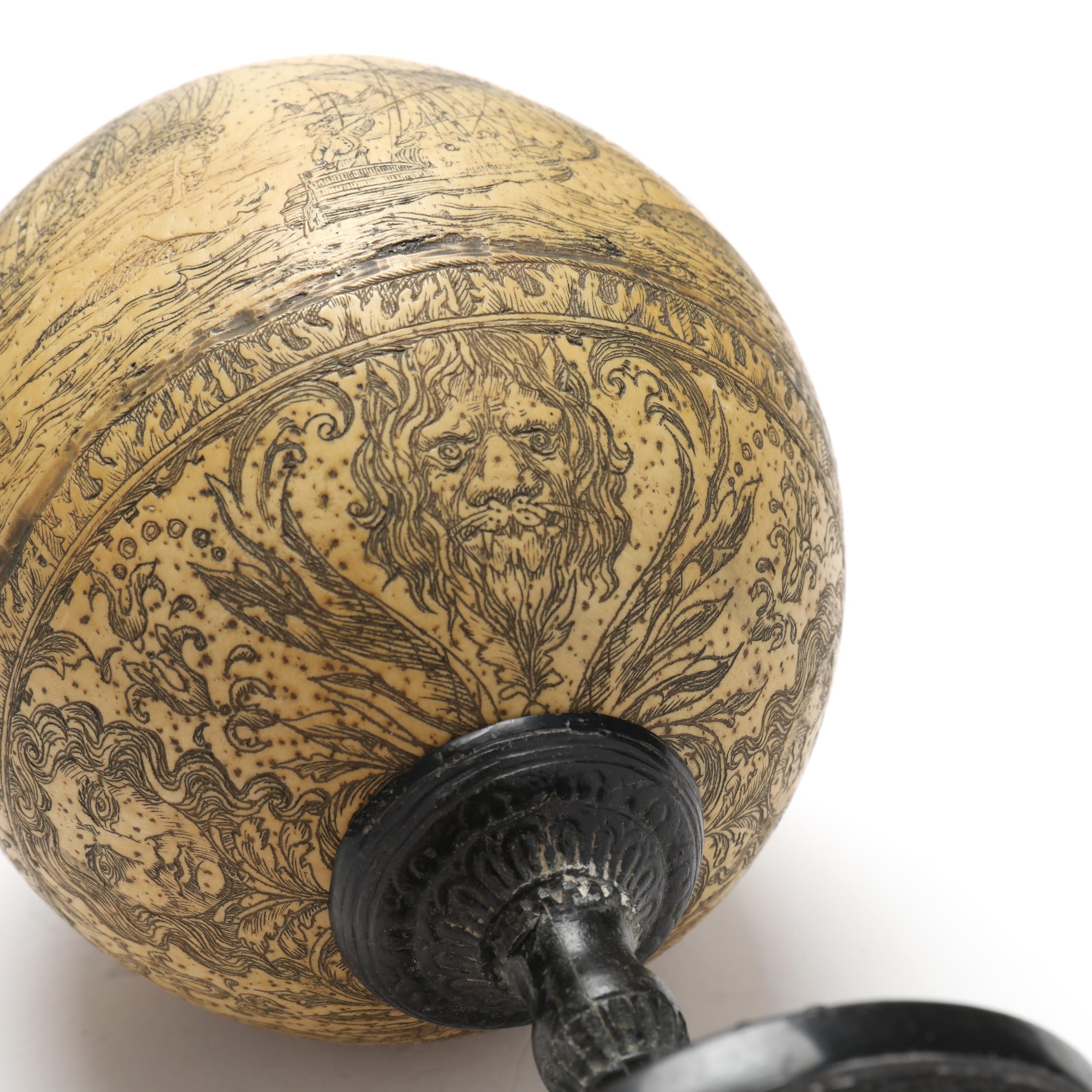 A Scrimshaw Ostrich Egg on Stand, Signed J. A. (Lot 2087 - August