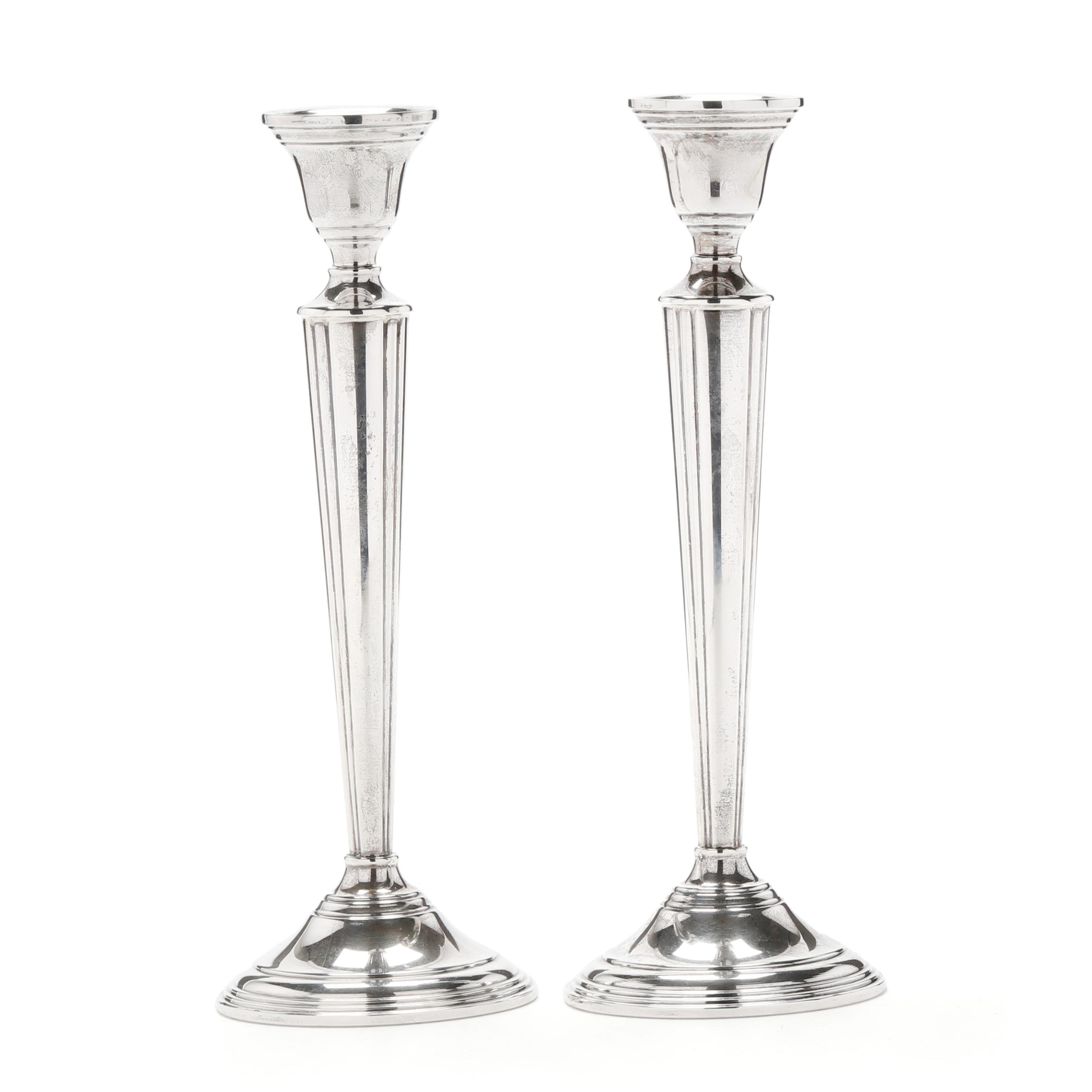 A Pair of Sterling Silver Candlesticks, Retailed by Cartier (Lot