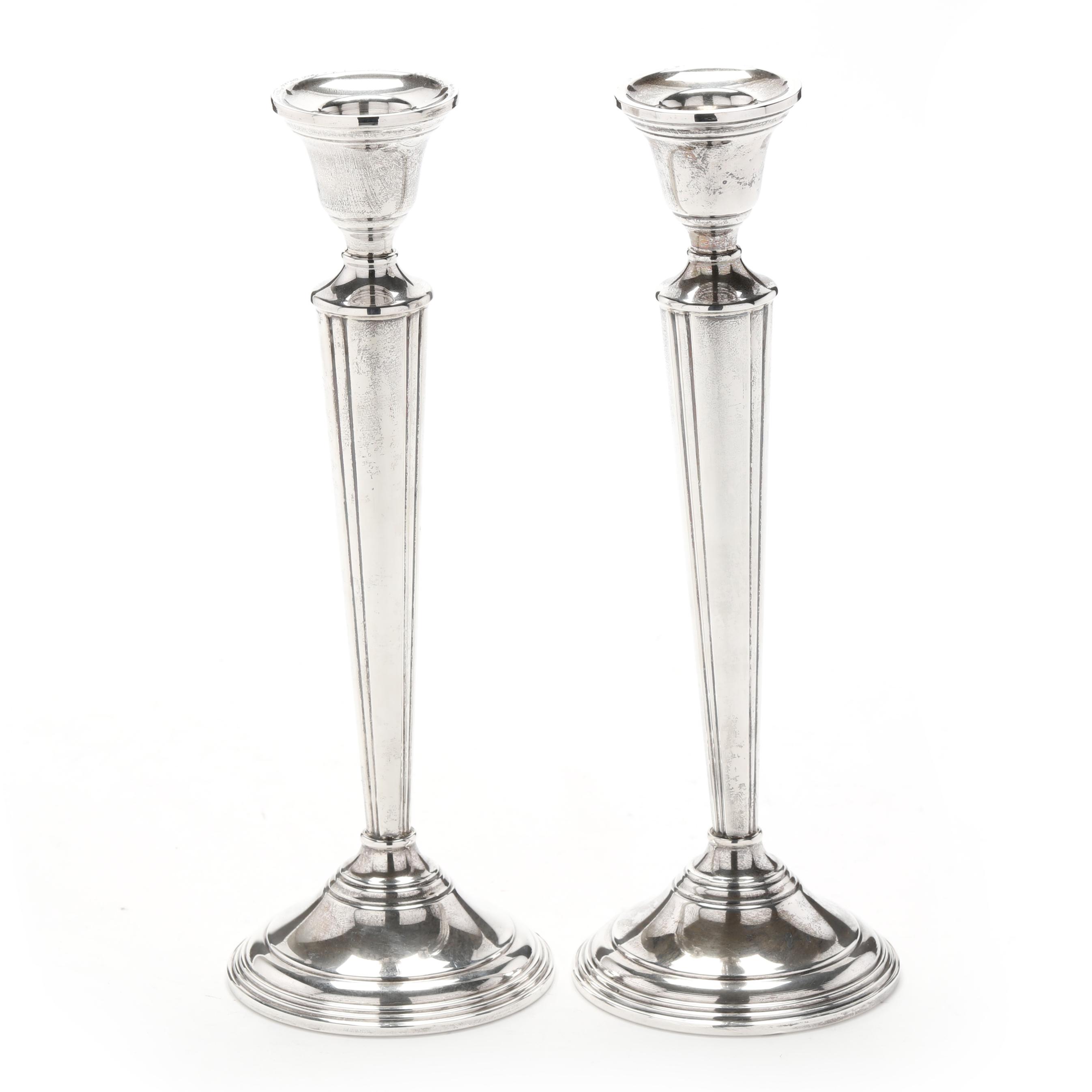 A Pair of Sterling Silver Candlesticks, Retailed by Cartier (Lot