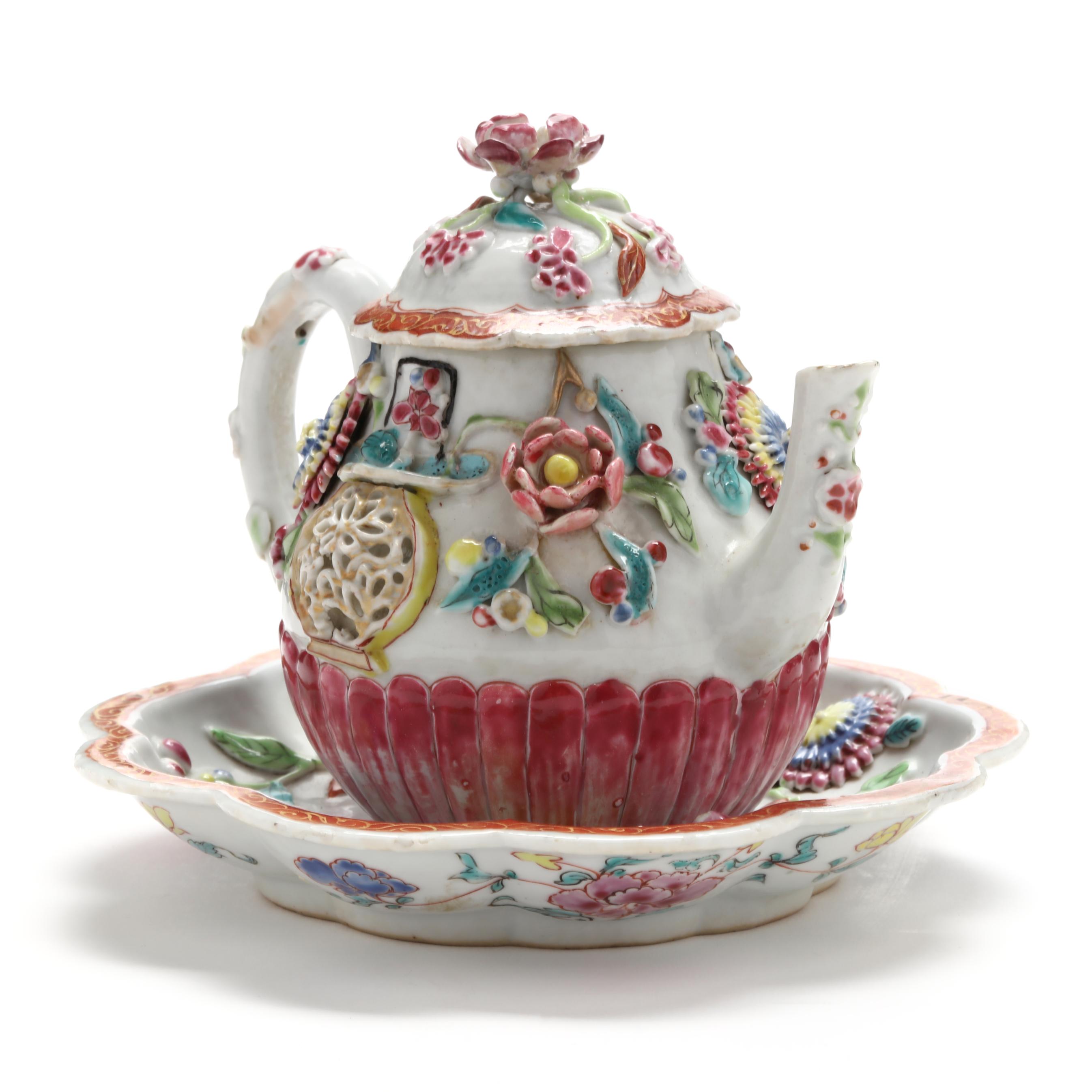 A Chinese Export Porcelain Molded and Relief Rose Teapot with