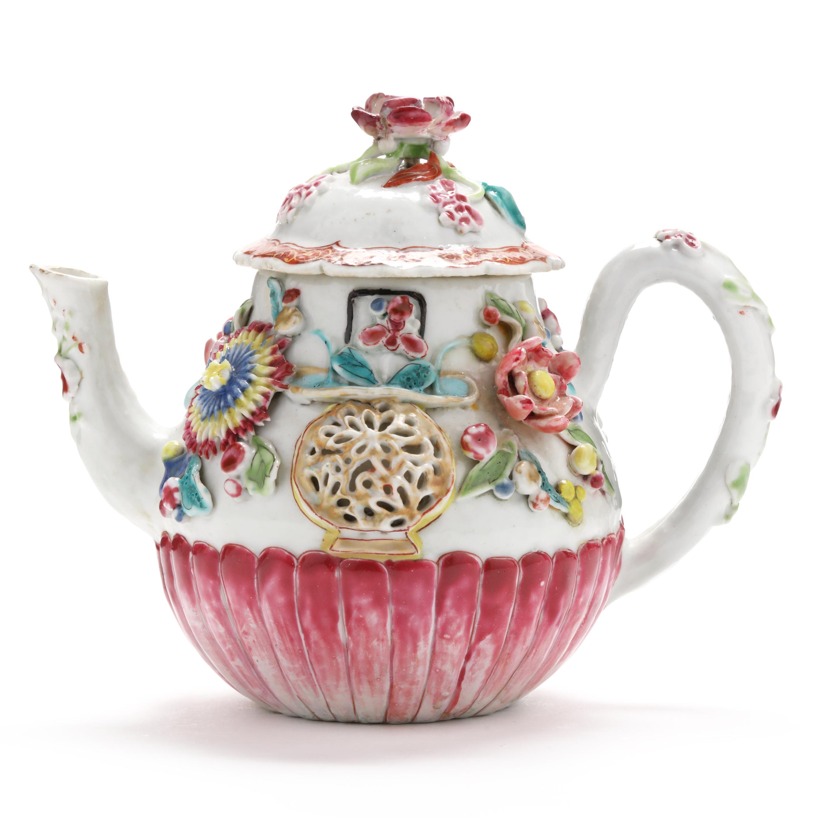 A Chinese Export Porcelain Molded and Relief Rose Teapot with