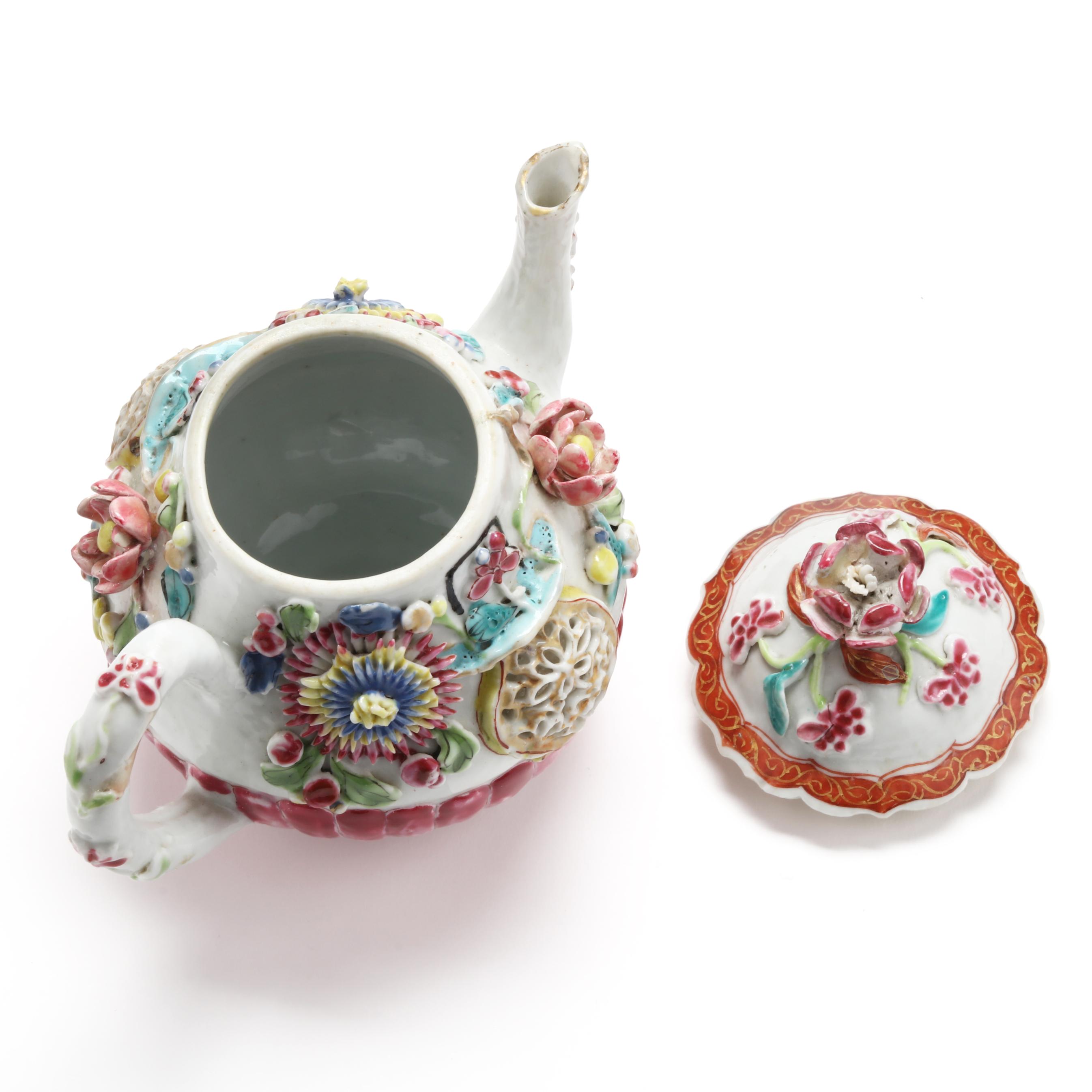 A Chinese Export Porcelain Molded and Relief Rose Teapot with