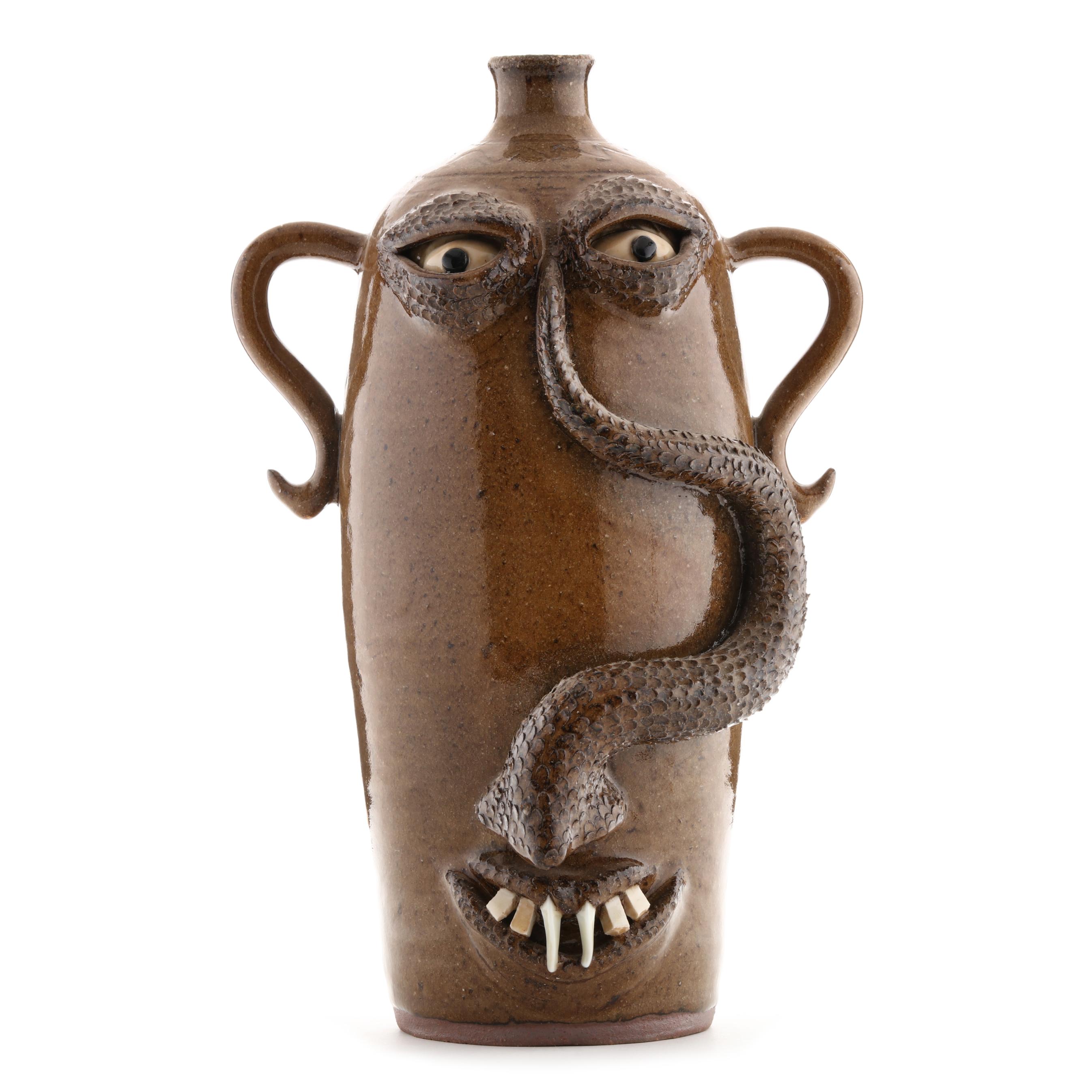 Don Craig (NC), Folk Art Pottery Face Jug with Snake (Lot 1168