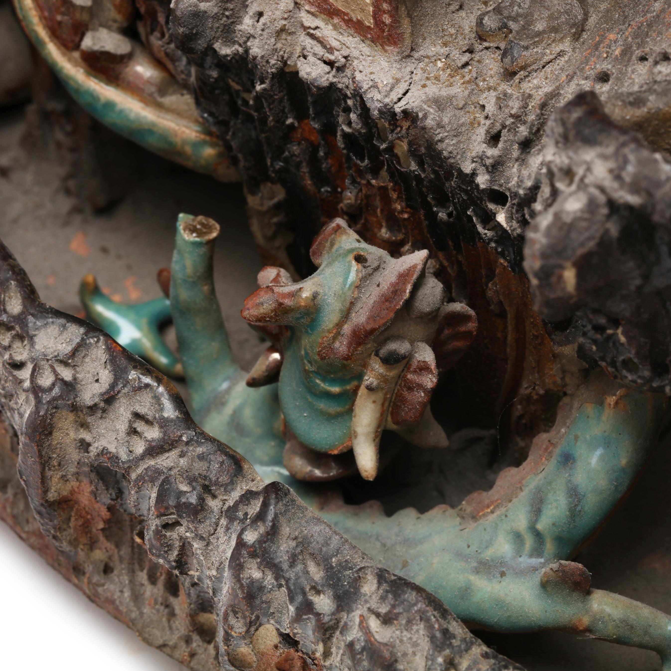 A Chinese Shiwan Glazed Pottery Mountain with Figures and