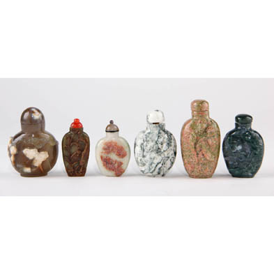 group-of-six-finely-carved-stone-snuff-bottles