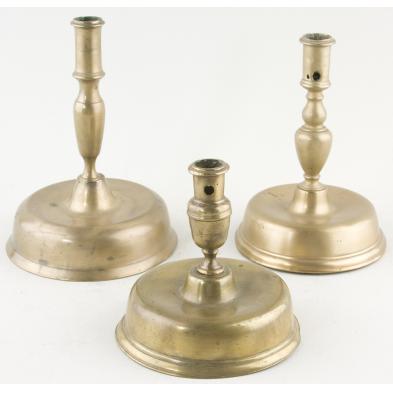 group-of-three-brass-candlesticks-ca-1700