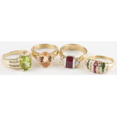 a-group-of-four-colored-stone-and-diamond-rings