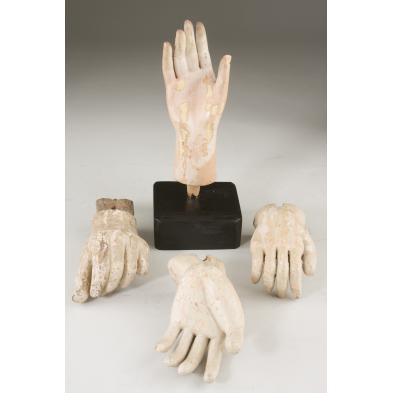 four-carved-wooden-santos-hands