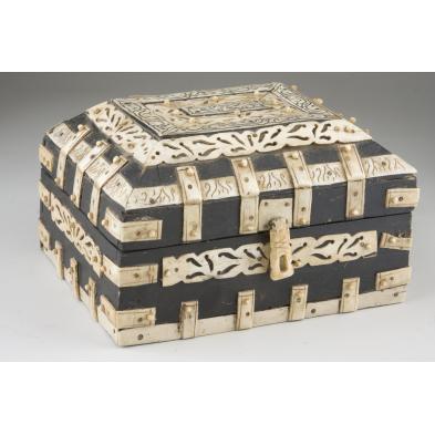 bone-mounted-wooden-casket