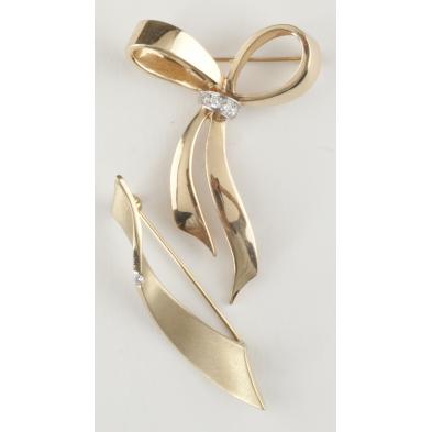two-gold-and-diamond-bow-brooches