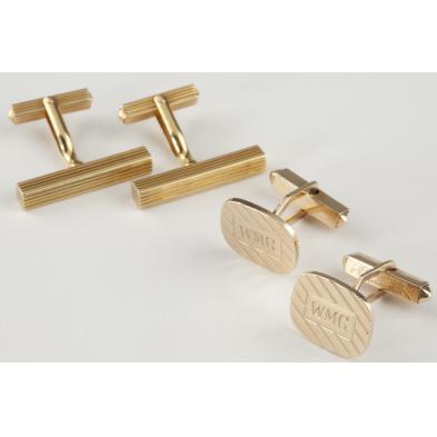 two-pairs-of-gold-cufflinks