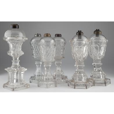 group-of-six-clear-glass-fluid-lamps