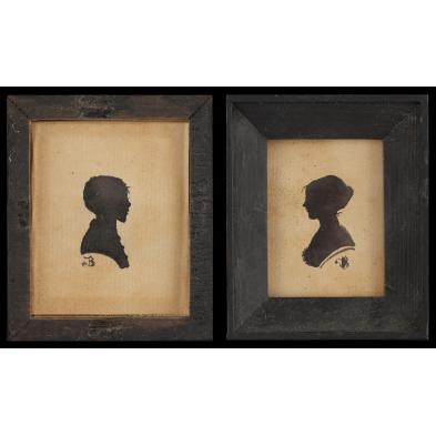 pair-of-miniature-silhouettes-of-mother-and-son
