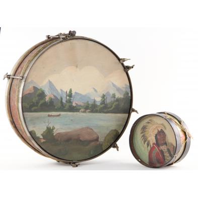 two-vintage-drums-with-painted-heads