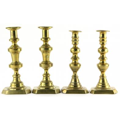 two-pair-of-brass-candlesticks