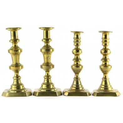 two-pair-of-brass-candlesticks