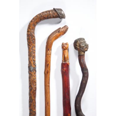 four-carved-folk-art-walking-sticks