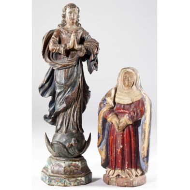two-carved-wooden-santos-figures