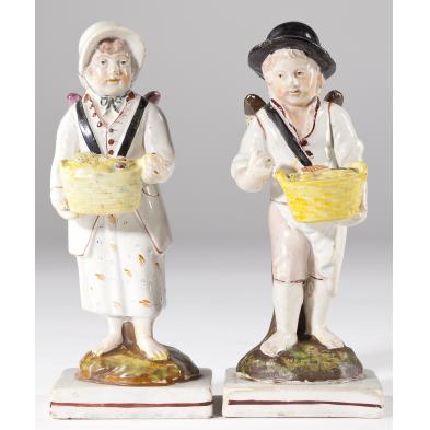pair-of-early-staffordshire-winged-figures
