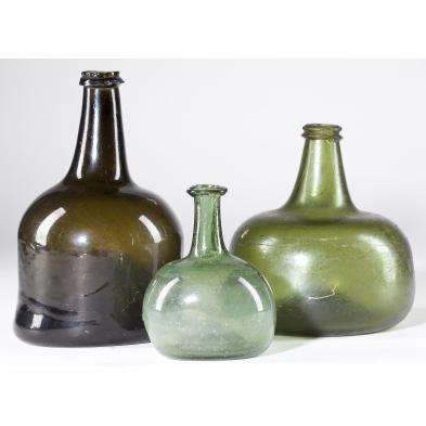 three-early-18th-century-glass-wine-bottles
