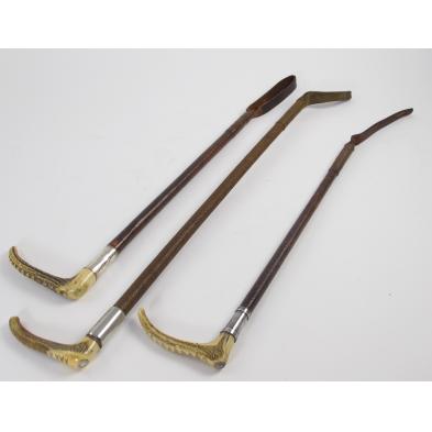 three-antique-leather-and-antler-riding-crops