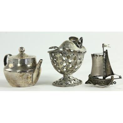 three-silver-miniatures