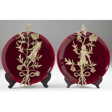 pair-of-oxblood-chargers-with-figural-mounts