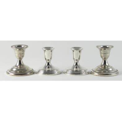 two-pair-of-sterling-candlesticks
