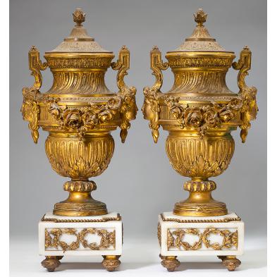 a-pair-of-belle-epoque-gilt-metal-lidded-urns