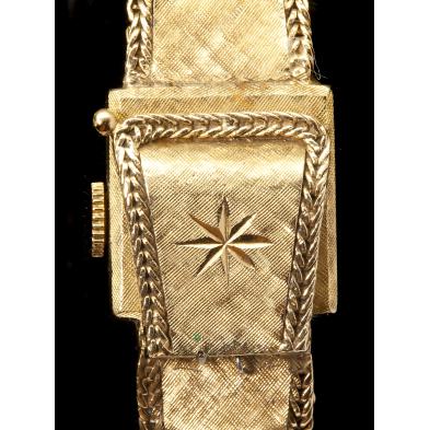 lady-s-gold-flip-top-bracelet-watch