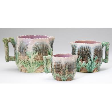 group-of-three-graduated-majolica-pitchers