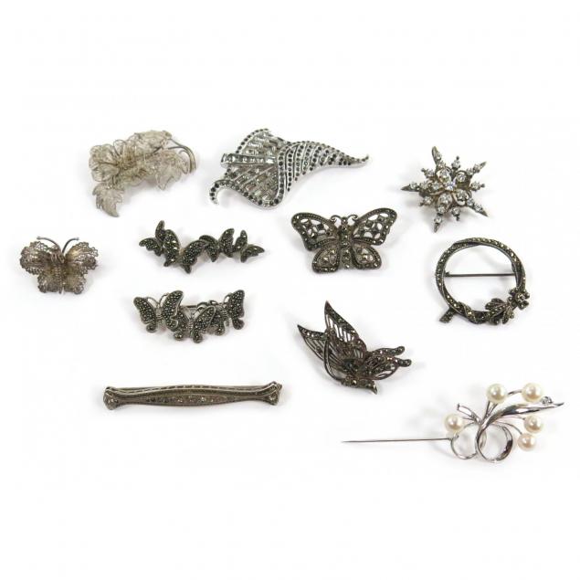 a-group-of-vintage-brooches
