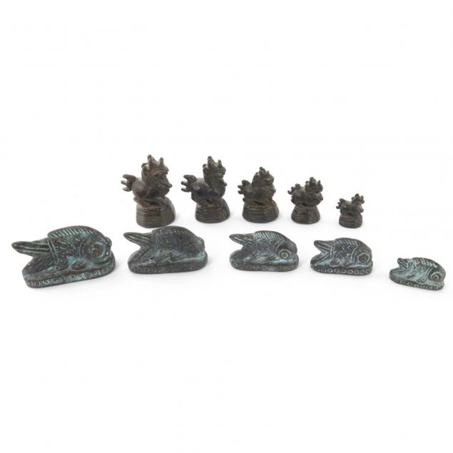two-sets-of-figural-opium-weights
