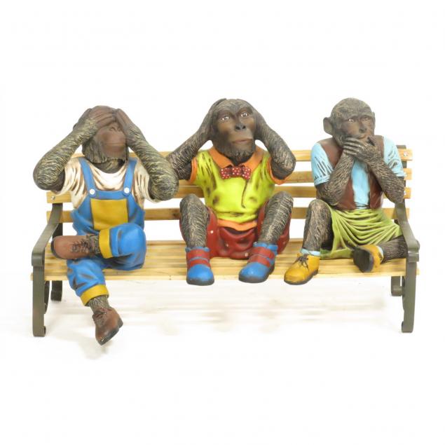 figural-sculpture-of-the-three-wise-monkeys-on-a-park-bench
