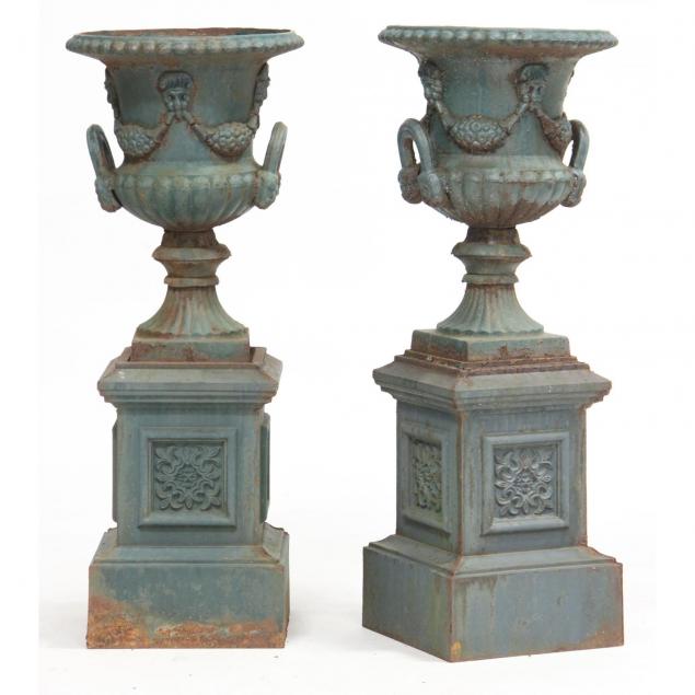 pair-of-cast-iron-garden-urns-on-pedestals