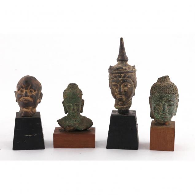 four-antique-bronze-buddha-heads