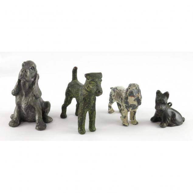 four-vintage-metal-dog-sculptures