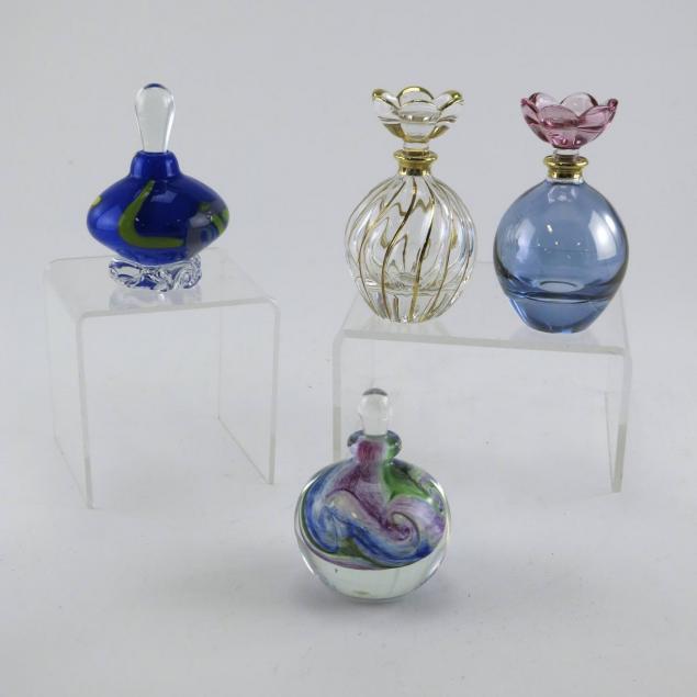 four-glass-perfume-bottles