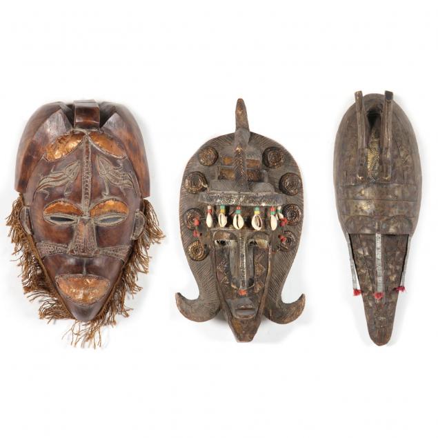 three-metal-decorated-african-tribal-masks