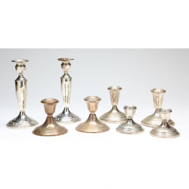 four-pairs-of-sterling-silver-candlesticks