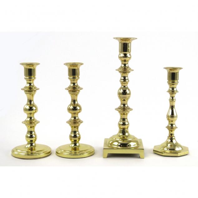 baldwin-group-of-four-brass-antique-style-candlesticks
