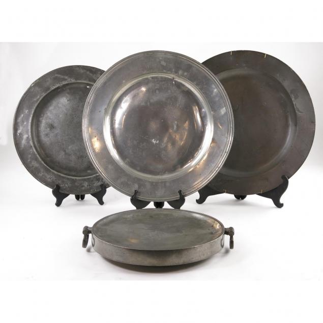 a-18th-century-pewter-warmer-three-large-chargers